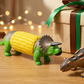 Soportes creativos para mazorcas de maíz con forma de dinosaurio