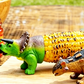 Soportes creativos para mazorcas de maíz con forma de dinosaurio