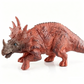Soportes creativos para mazorcas de maíz con forma de dinosaurio